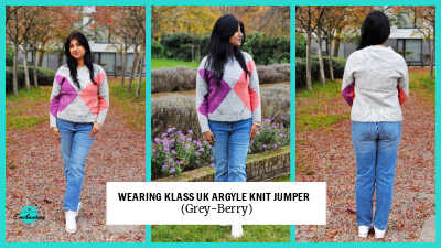 A three-panel collage of a woman modeling a light grey V-neck argyle knit jumper with purple and coral-pink diamonds, paired with straight-leg blue jeans and white sneakers. The first two panels show her facing forward and slightly to the side, and the third panel shows her full back view. Text across the bottom reads: "WEARING KLASS UK ARGYLE KNIT JUMPER (Grey-Berry).
