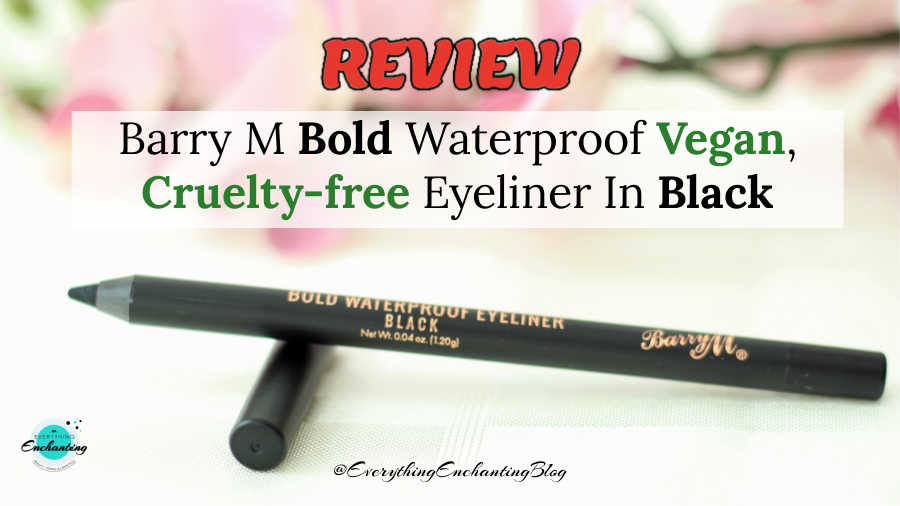 A horizontal featured image for a product review of the Barry M Bold Waterproof Eyeliner in black. The sharpened black kohl pencil rests on its cap against a soft-focus background of pink flowers. Large bold text at the top reads 