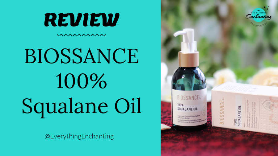 A product review graphic for Biossance 100% Squalane Oil. The left side features a bright teal panel with bold black text reading 'REVIEW' and 'BIOSSANCE 100% Squalane Oil'. The right side displays a photograph of the dark green glass pump bottle and its matching outer box resting on a dark red surface, with a small blog watermark logo in the top right corner.